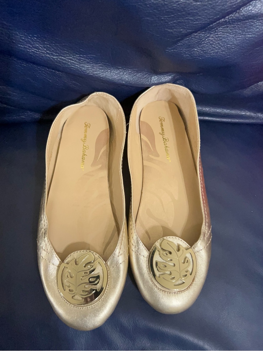 Tommy Bahama Women's Metallic Gold Round-Toe Flats with Decorative Medallion